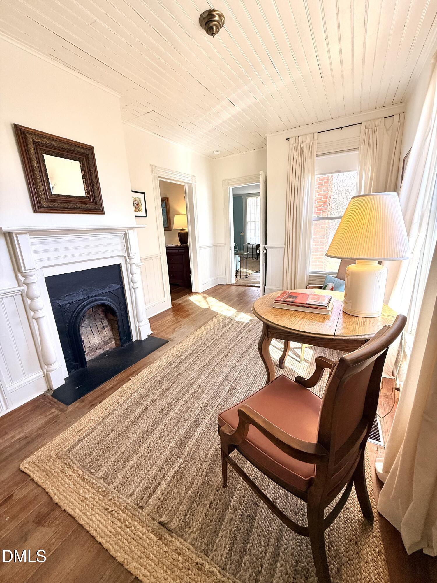 190 Broad Street Milton, NC 27305 - Photo 22 of 62 a bedroom with a bed and a fireplace