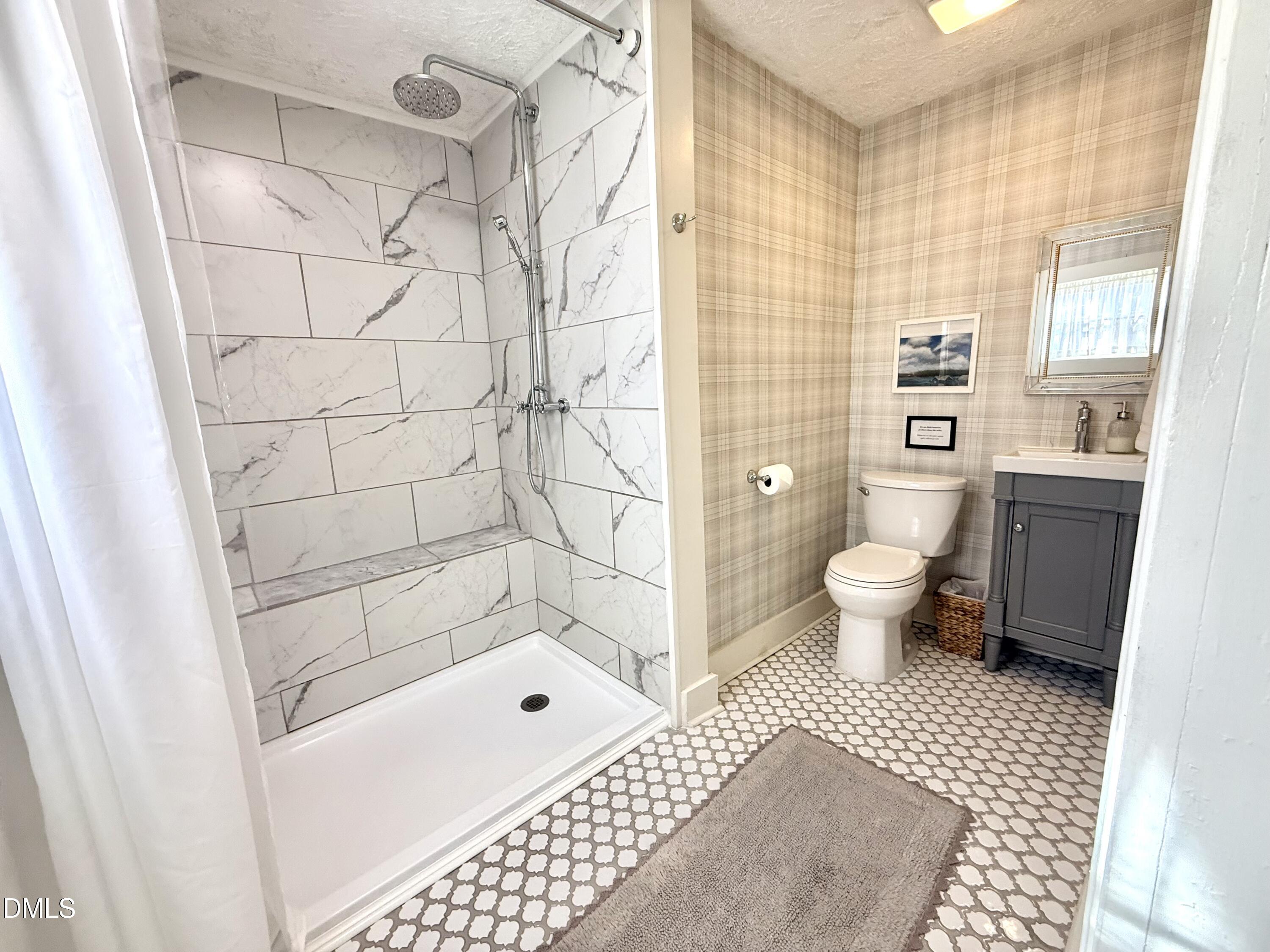 190 Broad Street Milton, NC 27305 - Photo 23 of 62 a bathroom with a toilet a sink and a shower