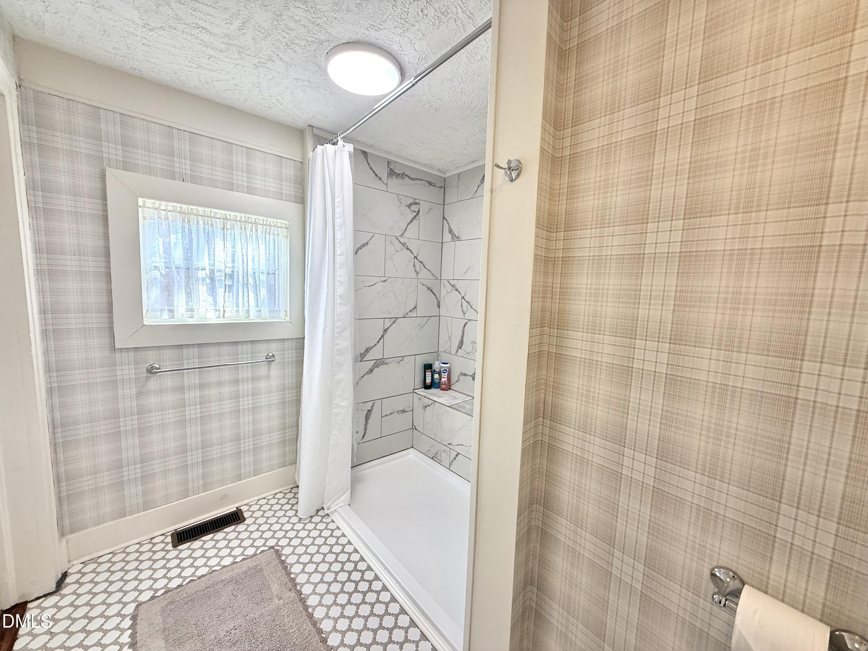 190 Broad Street Milton, NC 27305 - Photo 25 of 62 a bathroom with a bathtub and shower