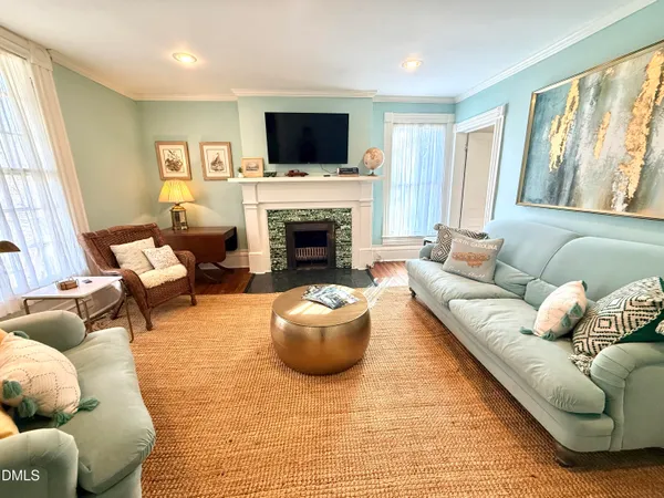 a living room with furniture and a fireplace