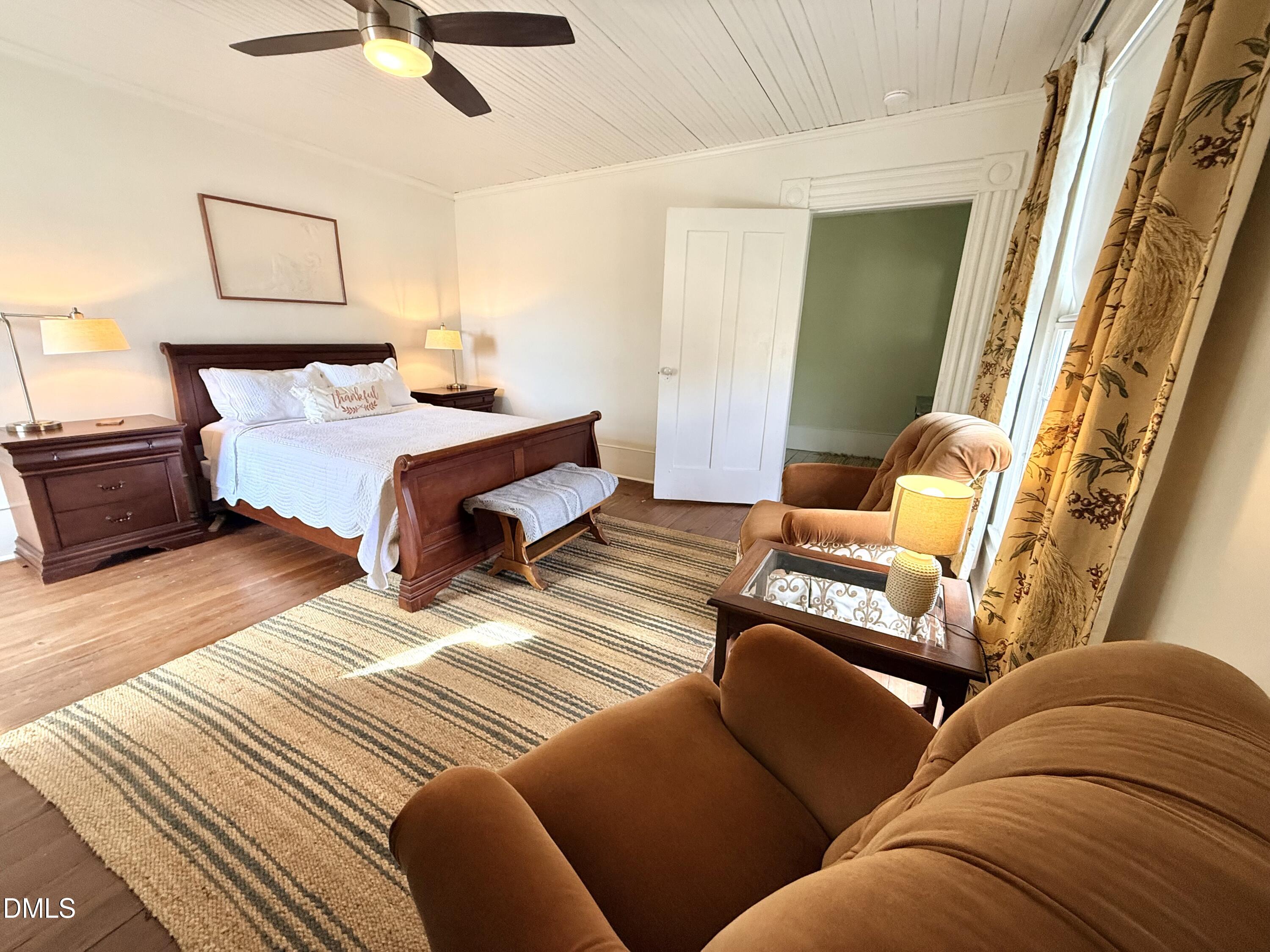 190 Broad Street Milton, NC 27305 - Photo 37 of 62 a bedroom with a bed and lamp