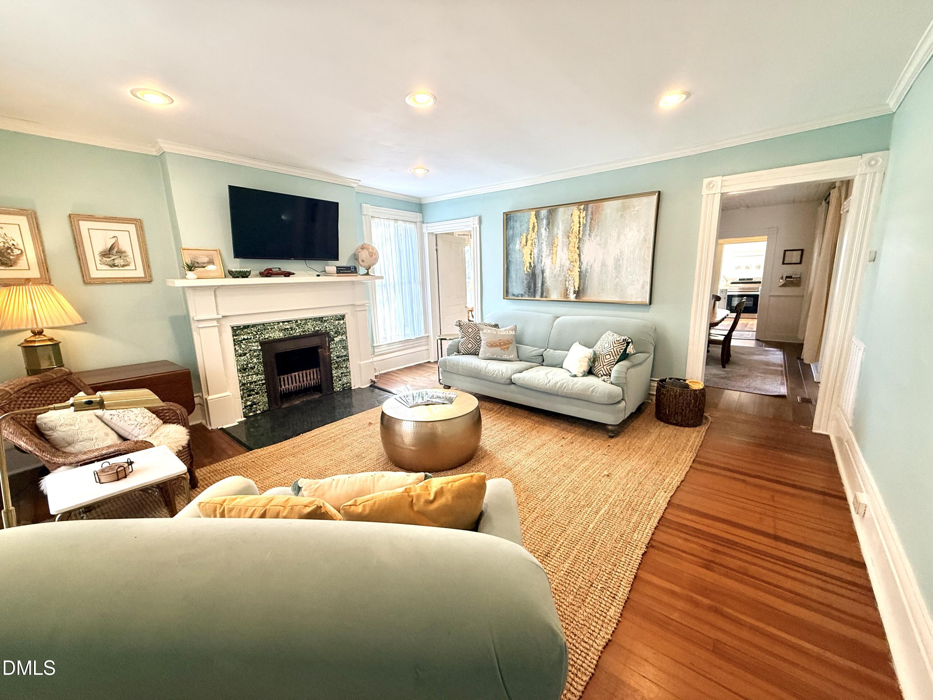 190 Broad Street Milton, NC 27305 - Photo 4 of 62 a living room with furniture and a fireplace