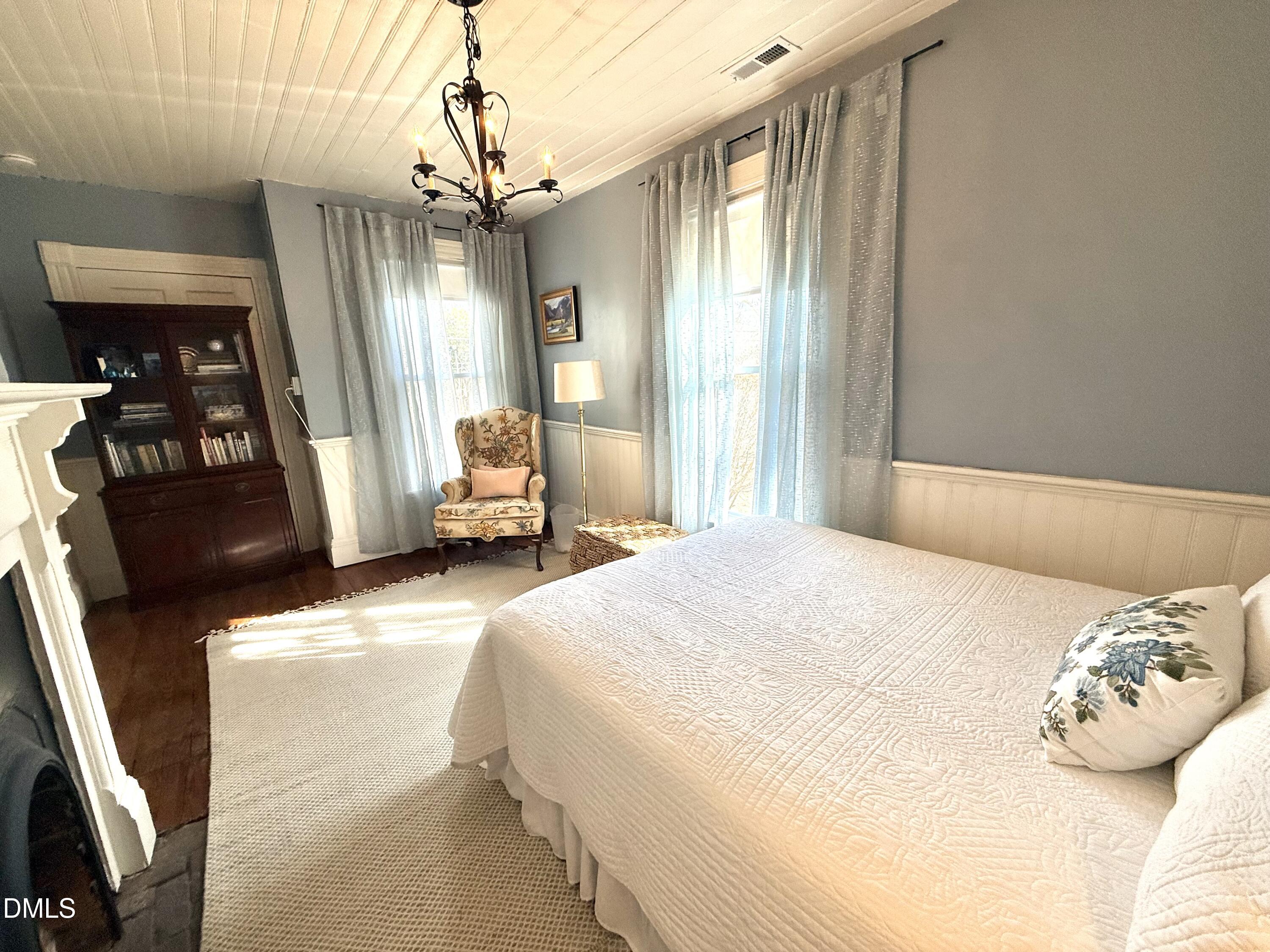 190 Broad Street Milton, NC 27305 - Photo 46 of 62 a bedroom with a bed mirror and a window