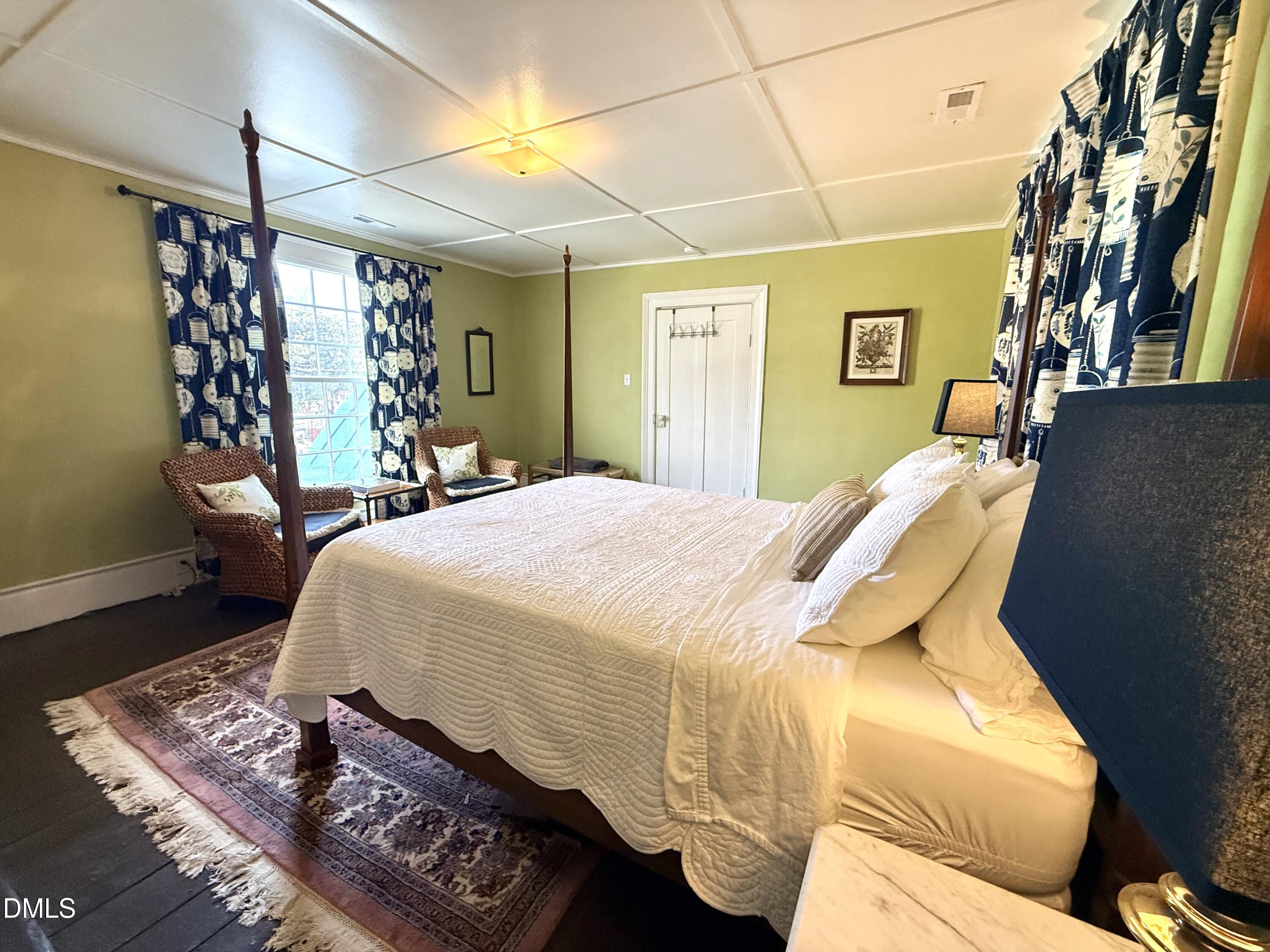 190 Broad Street Milton, NC 27305 - Photo 49 of 62 a bed sitting in a bedroom next to a window