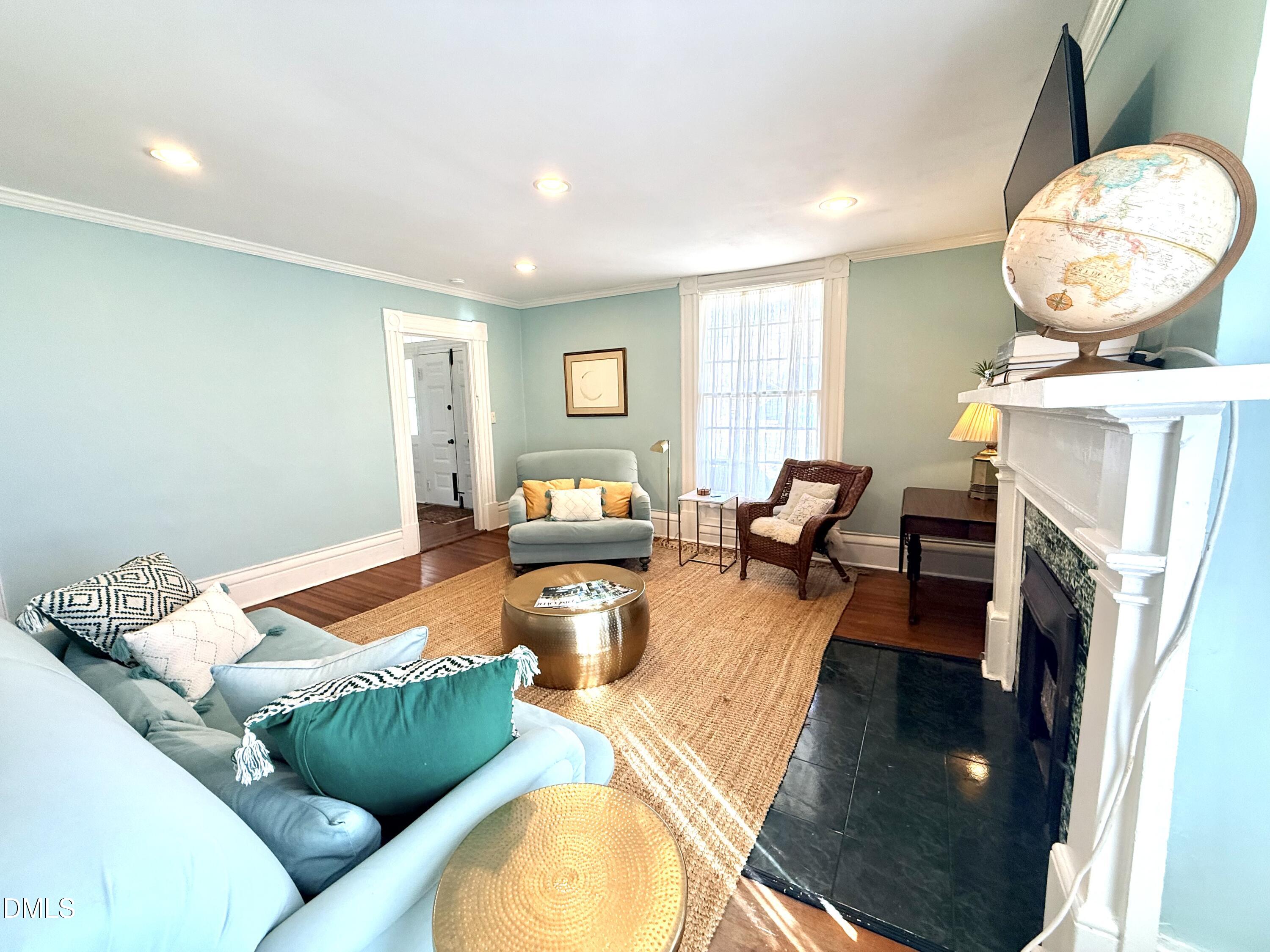 190 Broad Street Milton, NC 27305 - Photo 5 of 62 a living room with furniture and a fireplace
