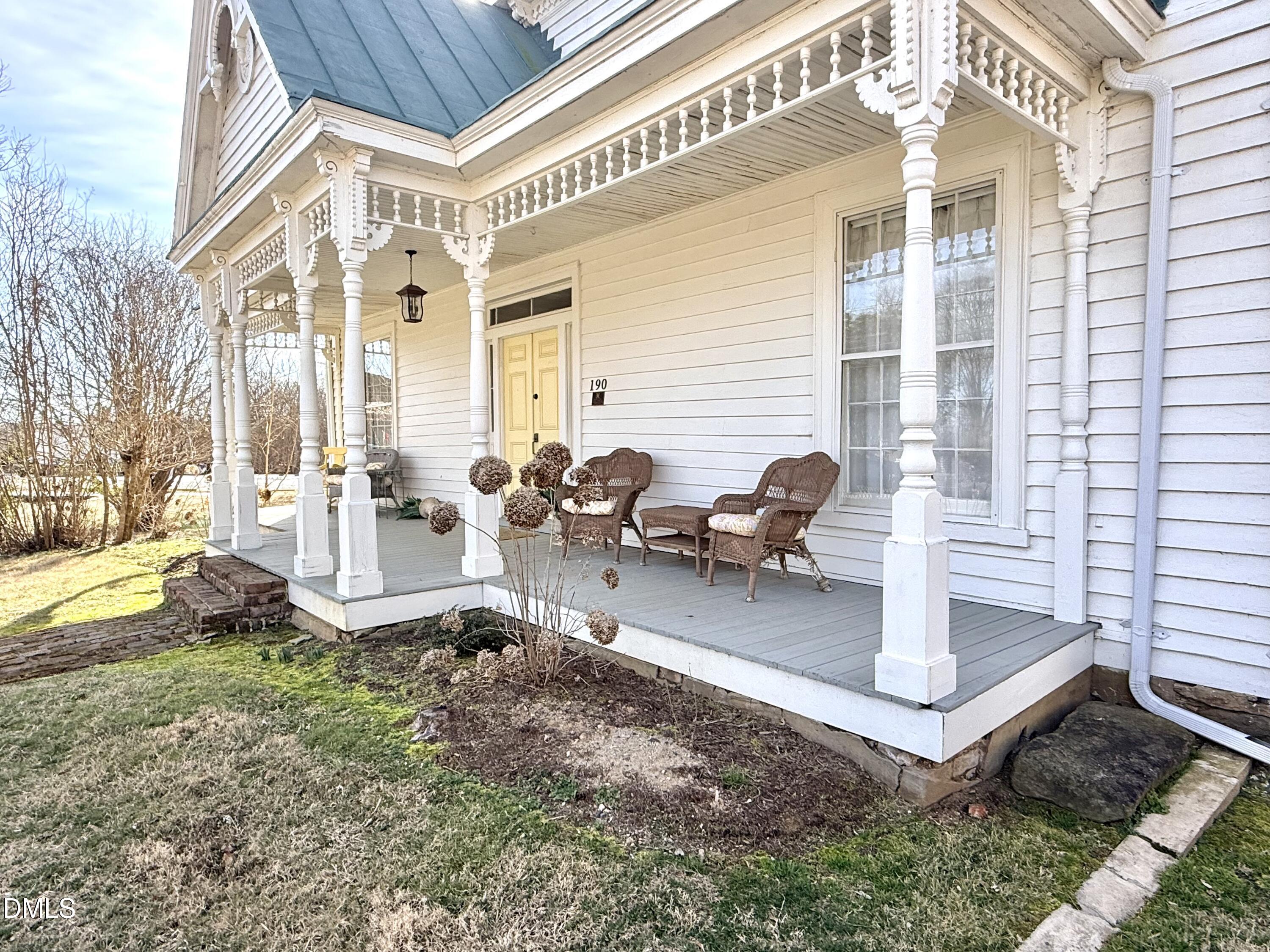 190 Broad Street Milton, NC 27305 - Photo 60 of 62 a view of a patio with table and chairs and potted plants
