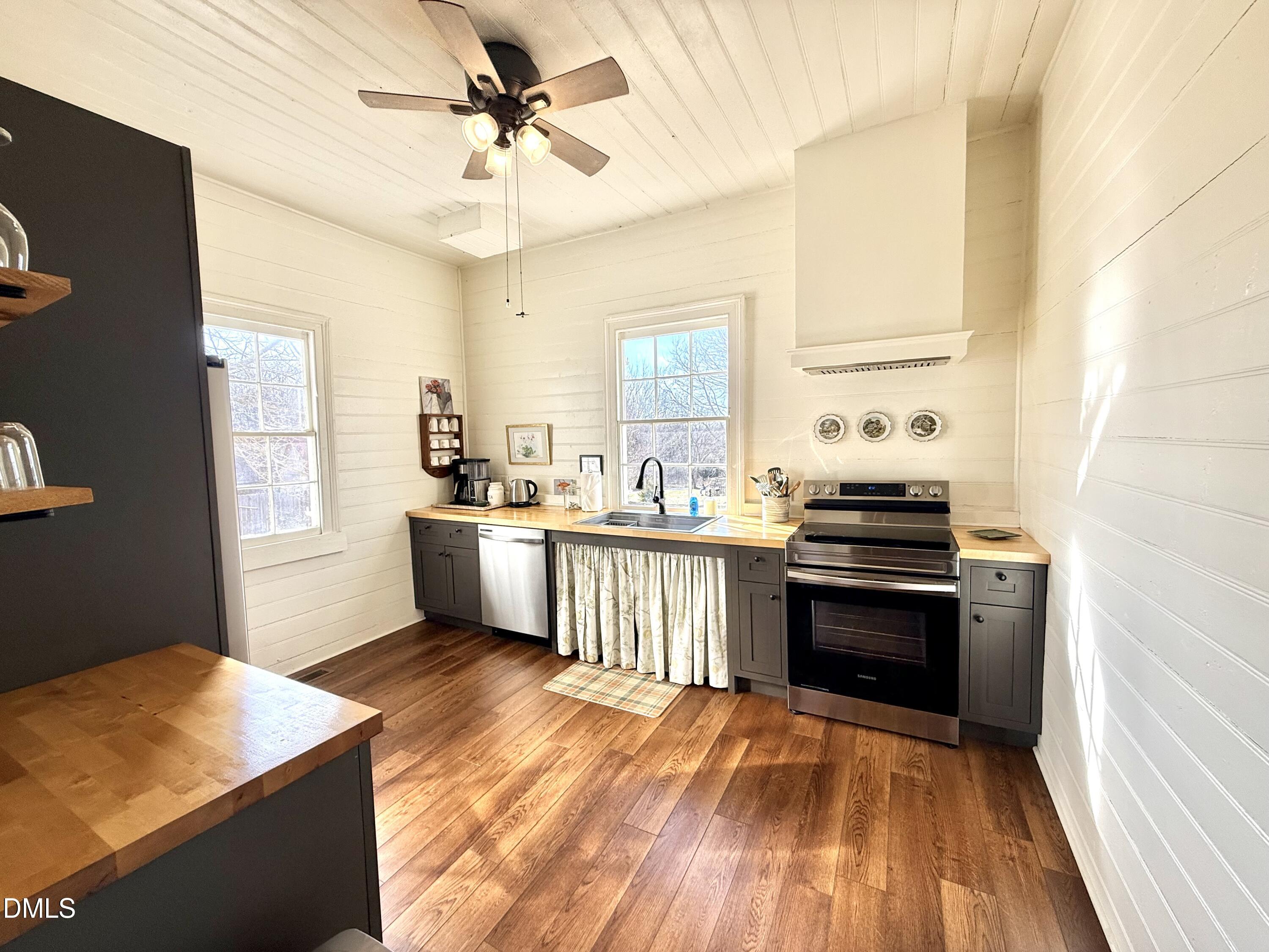 190 Broad Street Milton, NC 27305 - Photo 6 of 62 a kitchen with stainless steel appliances kitchen island granite countertop a stove a sink and a refrigerator