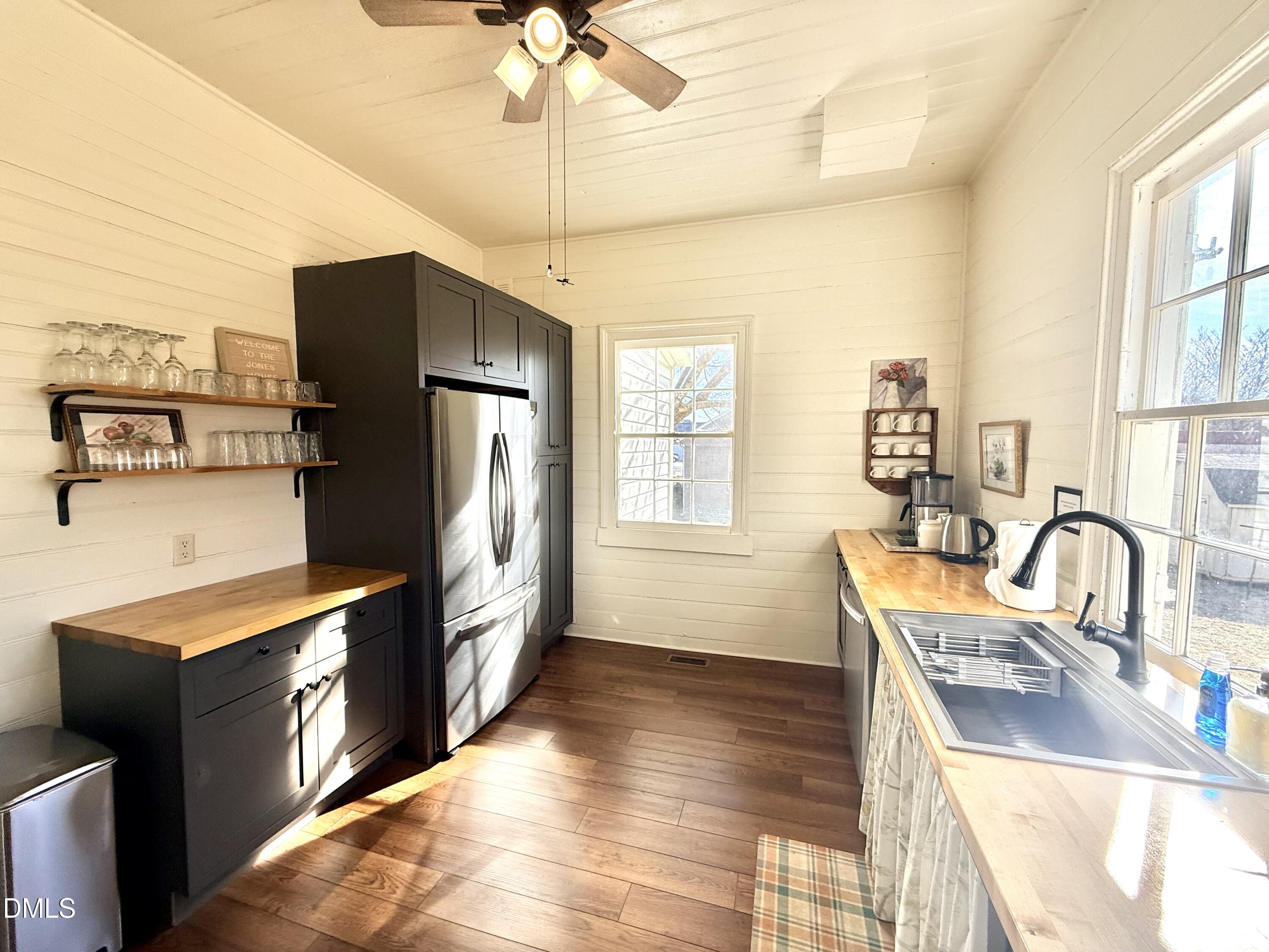 190 Broad Street Milton, NC 27305 - Photo 8 of 62 a kitchen with stainless steel appliances granite countertop a sink a stove and refrigerator