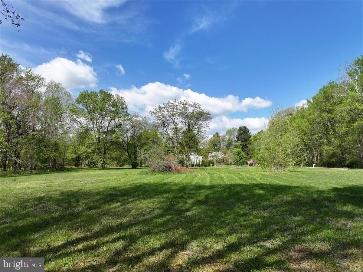 839 Crandell Road West River, MD 20778 - Photo 6 of 24 a view of a grassy field with trees in the background