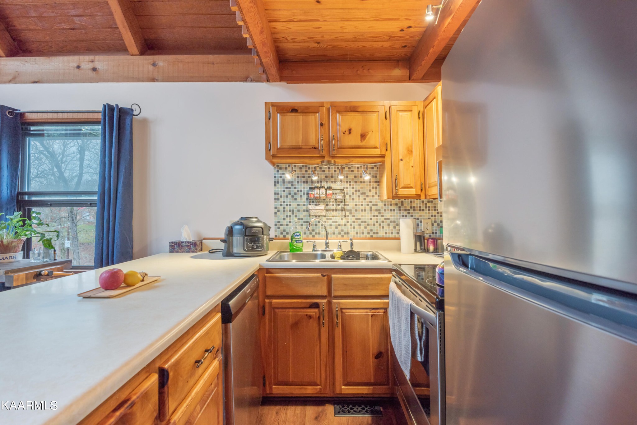2356 Black Oak Ridge Road Sevierville, TN 37876 - Photo 13 of 33 a kitchen that has a sink and a table in it