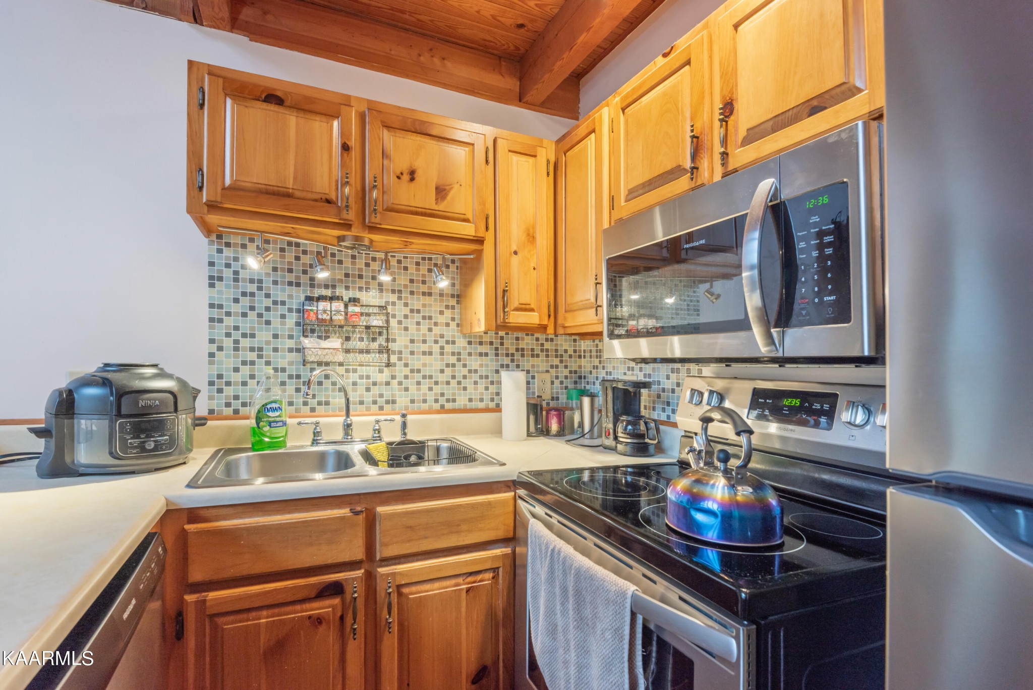 2356 Black Oak Ridge Road Sevierville, TN 37876 - Photo 14 of 33 a kitchen with stainless steel appliances a sink and cabinets