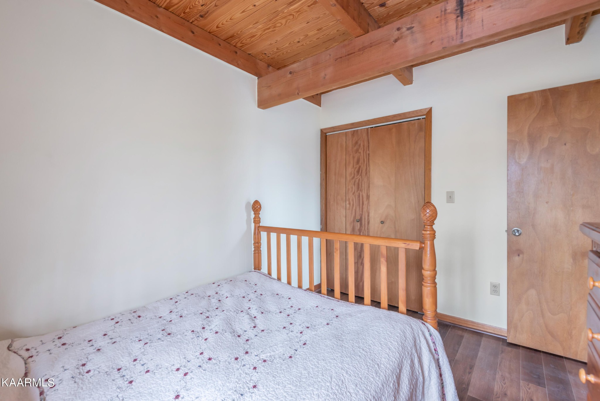 2356 Black Oak Ridge Road Sevierville, TN 37876 - Photo 19 of 33 a bedroom with a bed and wooden floor