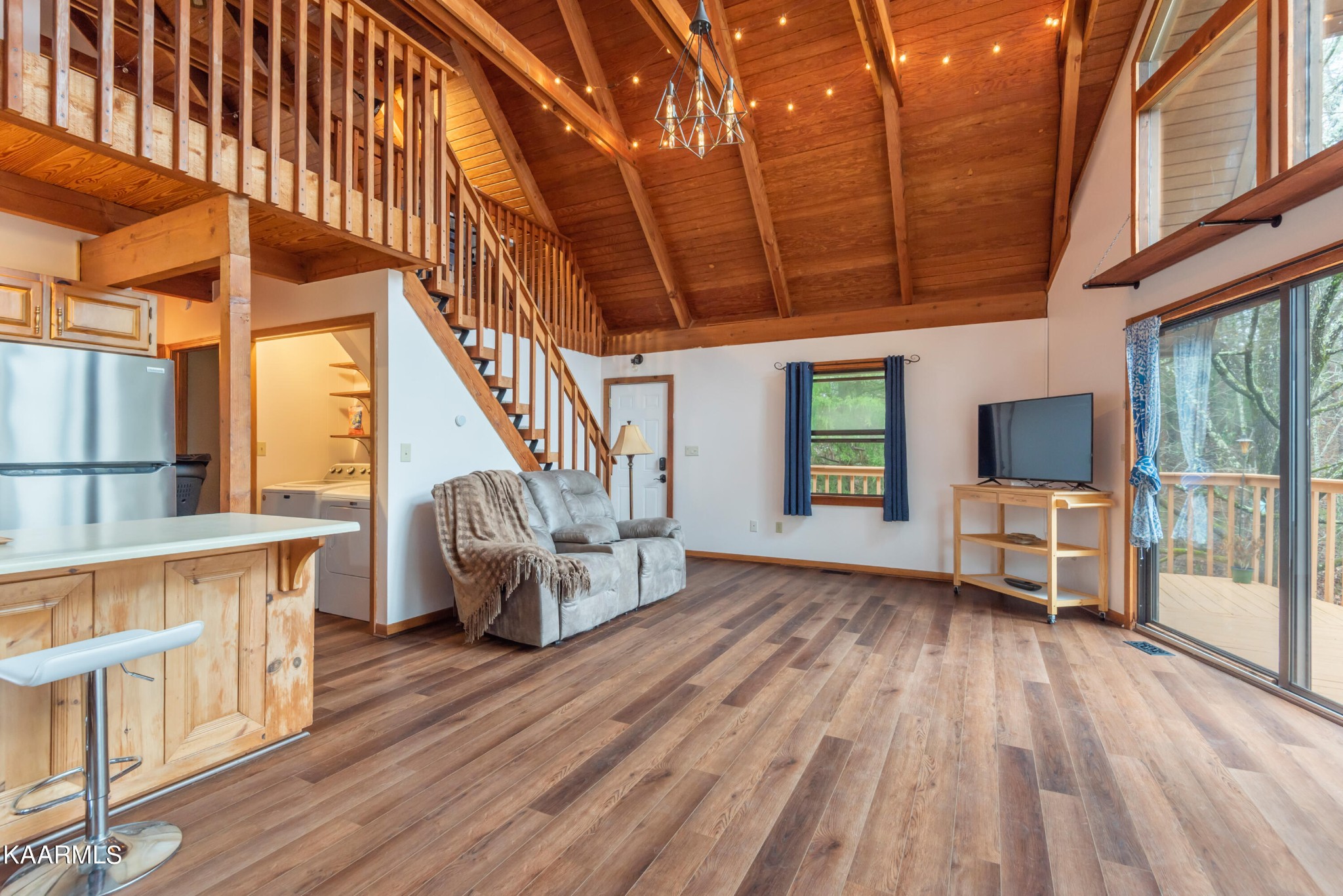 2356 Black Oak Ridge Road Sevierville, TN 37876 - Photo 9 of 33 a view of livingroom with furniture staircase and windows