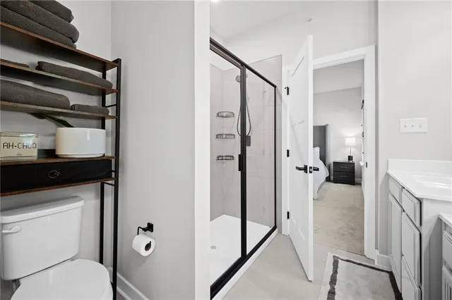 a en suite bathroom with a sink toilet and shower