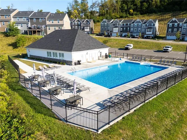 a view of a swimming pool and mountains