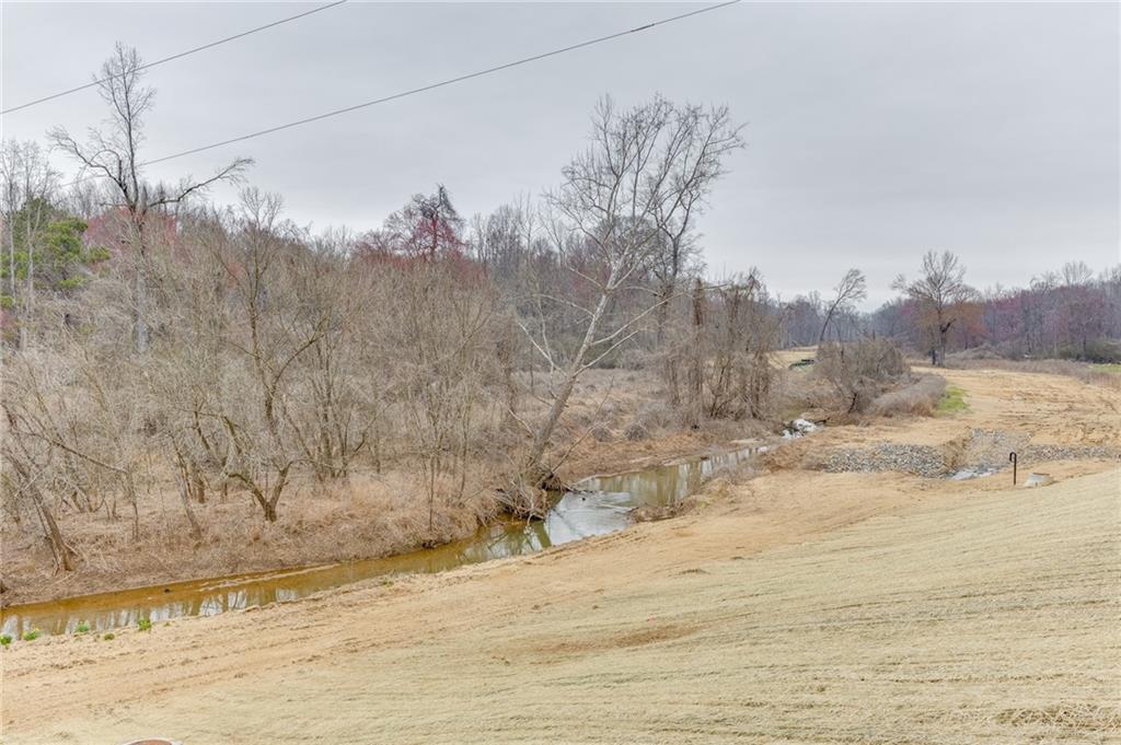 0 Hendrix Road Cumming, GA 30040 - Photo 12 of 28 a view of a dry yard covered with snow in the background