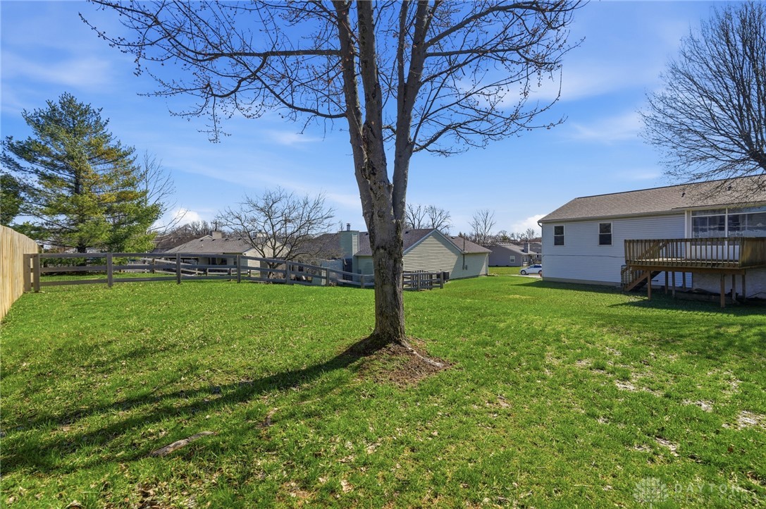 280 Stillpass Way Monroe, OH 45050 - Photo 42 of 49 This spacious yard offers ample green space and a wooden fence for privacy.
