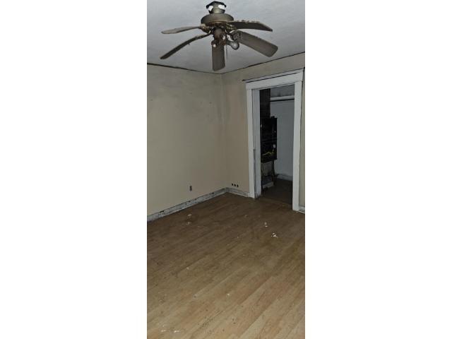 700 North Boone Street Olney, IL 62450 - Photo 3 of 12 a view of a room with a ceiling fan