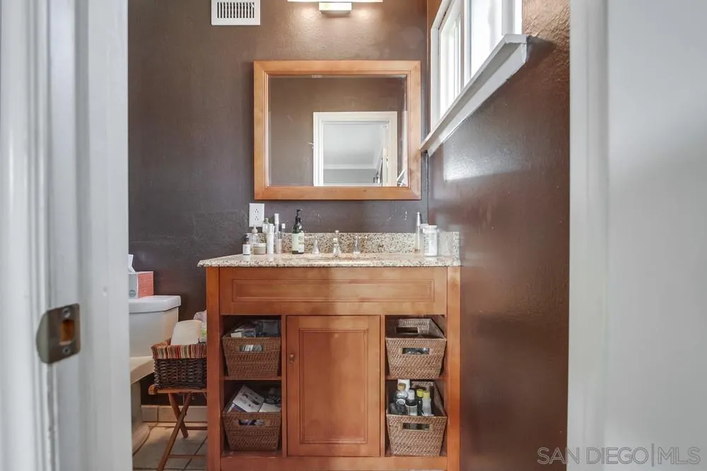 1800 Guevara Road Carlsbad, CA 92008 - Photo 19 of 29 a bathroom with a sink and a mirror