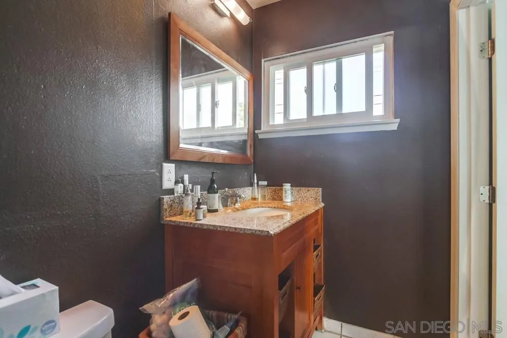 1800 Guevara Road Carlsbad, CA 92008 - Photo 20 of 29 a bathroom with a sink toilet and window