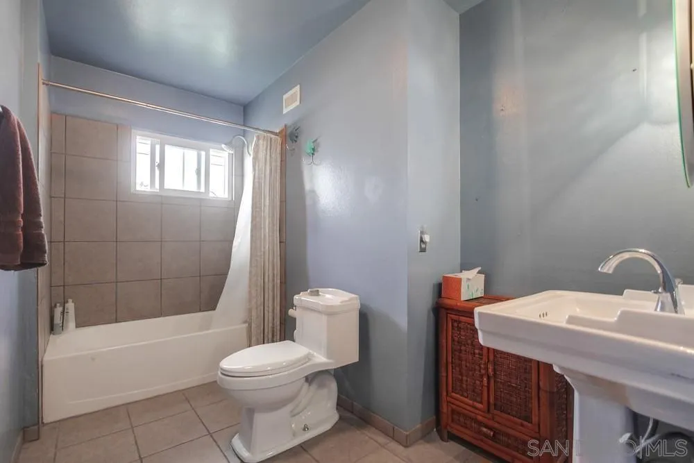 1800 Guevara Road Carlsbad, CA 92008 - Photo 21 of 29 a bathroom with a sink a toilet and shower