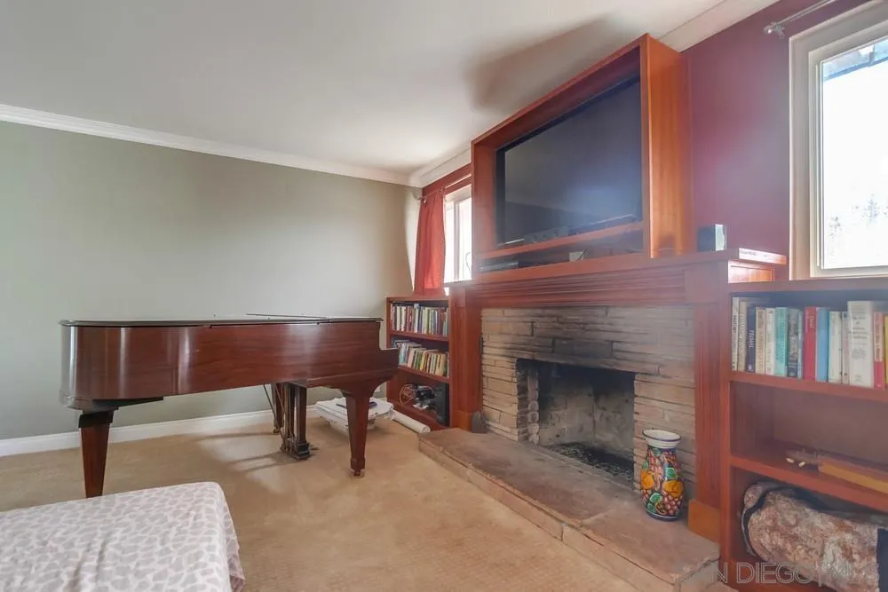 1800 Guevara Road Carlsbad, CA 92008 - Photo 5 of 29 a living room with furniture and a fireplace