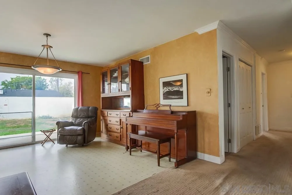 1800 Guevara Road Carlsbad, CA 92008 - Photo 7 of 29 a living room with furniture and a large window
