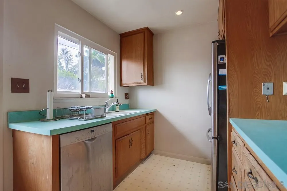 1800 Guevara Road Carlsbad, CA 92008 - Photo 9 of 29 a kitchen with a sink and a window