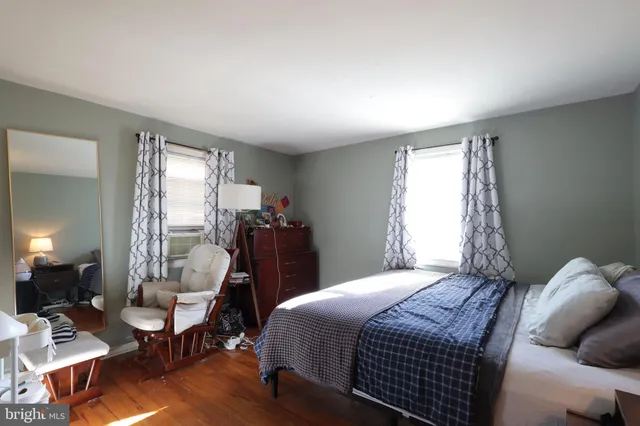 a bedroom with bed and a closet