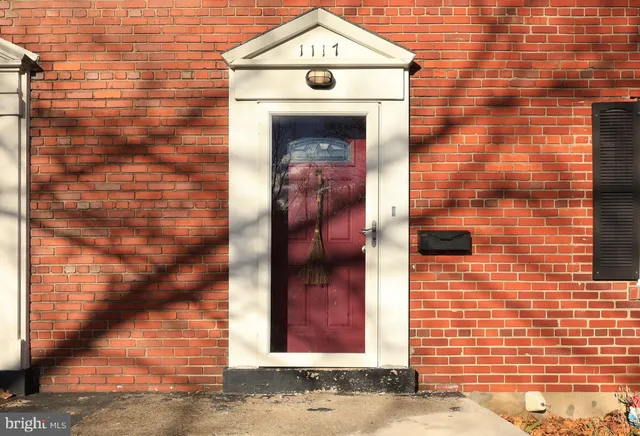 a view of entrance with a wall