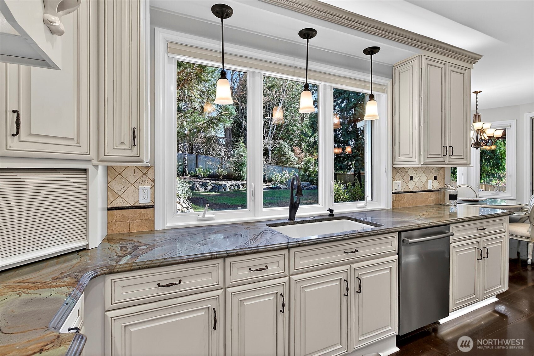 34529 5th Place Southwest Federal Way, WA 98023 - Photo 15 of 40 a kitchen with stainless steel appliances granite countertop white cabinets and a large window