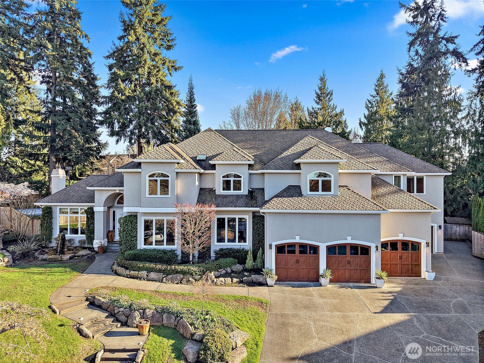 34529 5th Place Southwest Federal Way, WA 98023 - Photo 2 of 40 a view of a white house with large trees in front of it