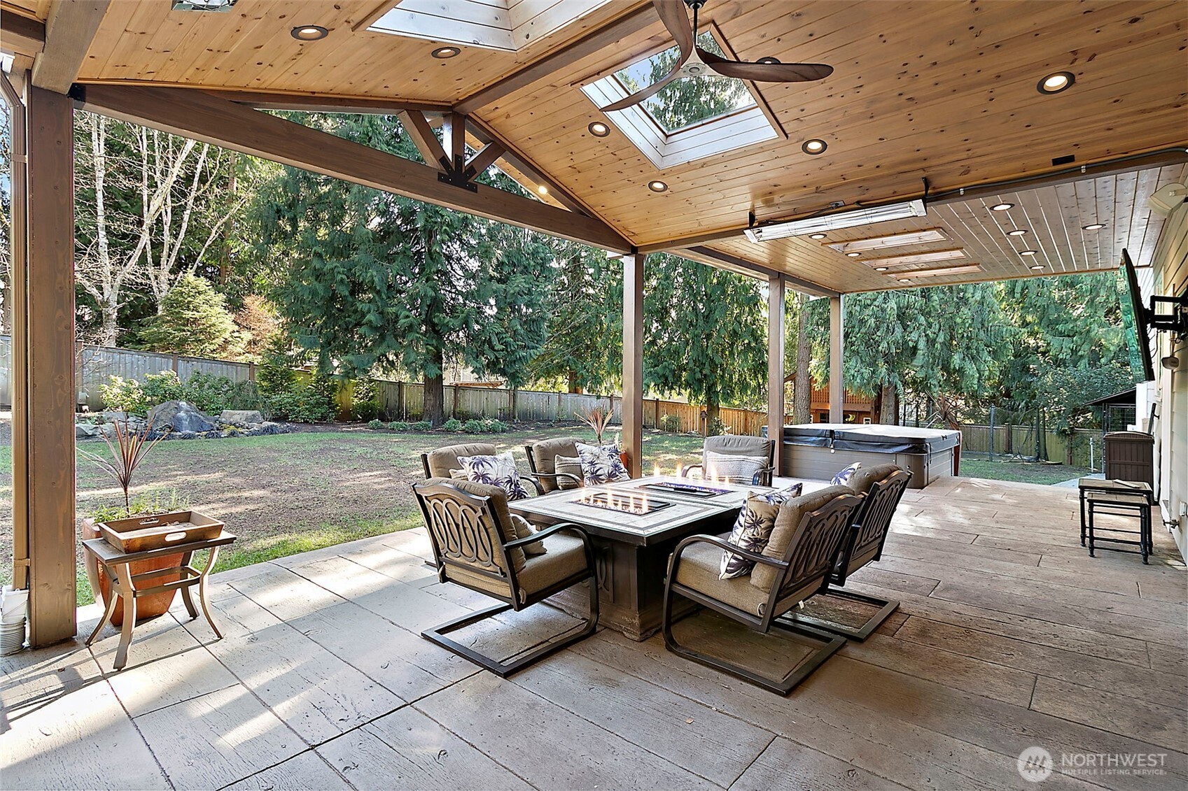 34529 5th Place Southwest Federal Way, WA 98023 - Photo 37 of 40 a view of a patio with a table and chairs under an umbrella with a small yard