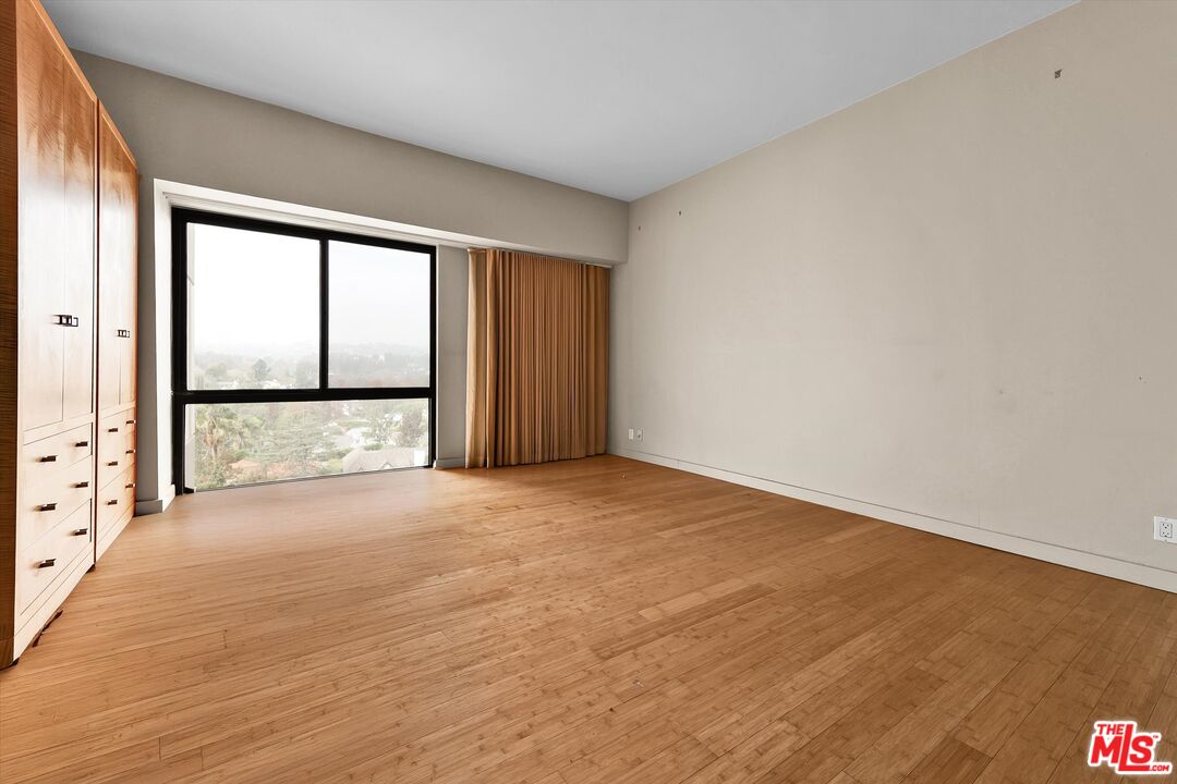 10445 Wilshire Boulevard, Unit 904 Los Angeles, CA 90024 - Photo 21 of 40 a view of an empty room with a window