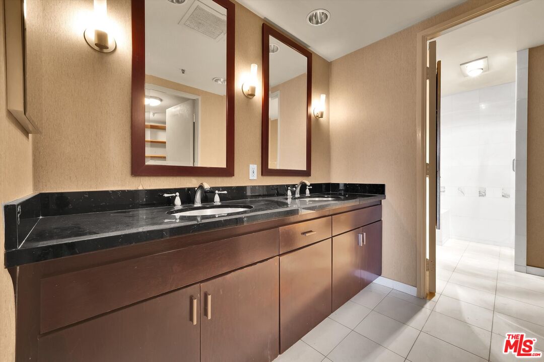 10445 Wilshire Boulevard, Unit 904 Los Angeles, CA 90024 - Photo 22 of 40 a bathroom with a sink and a mirror