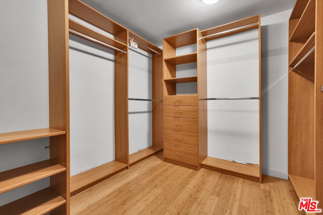 10445 Wilshire Boulevard, Unit 904 Los Angeles, CA 90024 - Photo 25 of 40 an empty room with wooden floor and a window