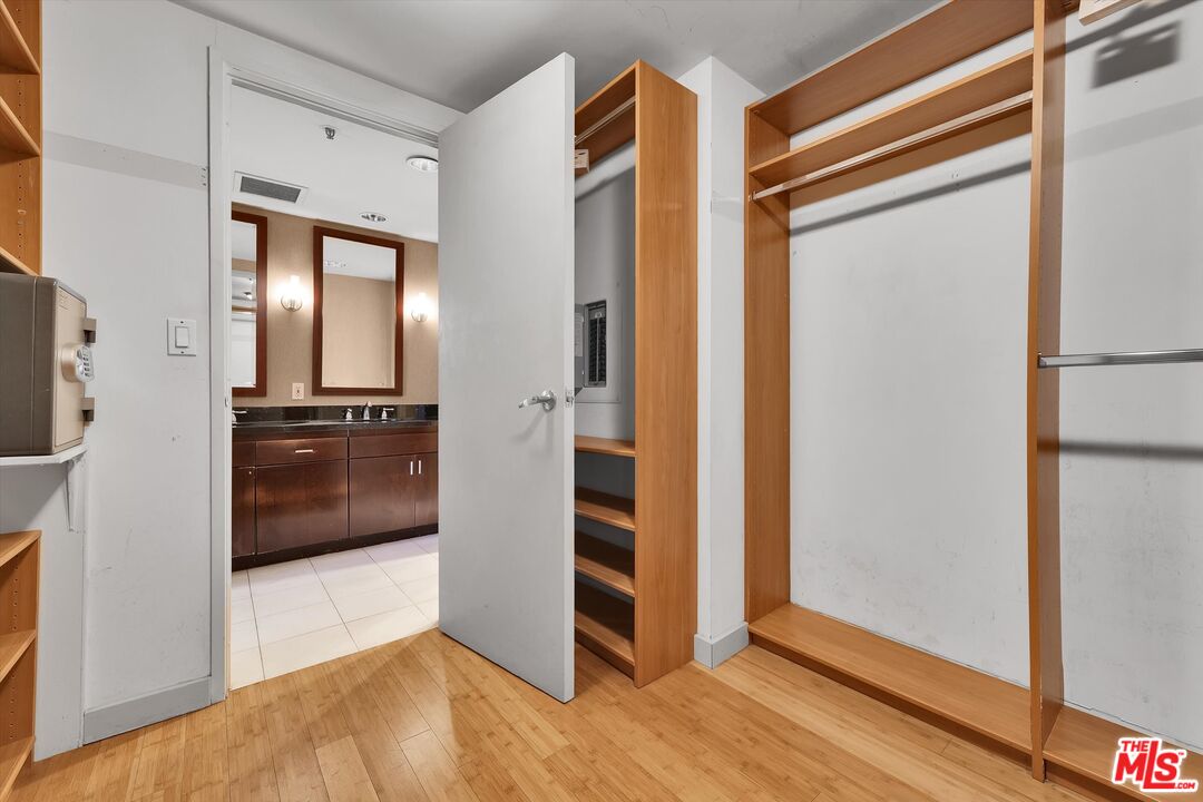 10445 Wilshire Boulevard, Unit 904 Los Angeles, CA 90024 - Photo 26 of 40 a view of a hallway with wooden floor and closet