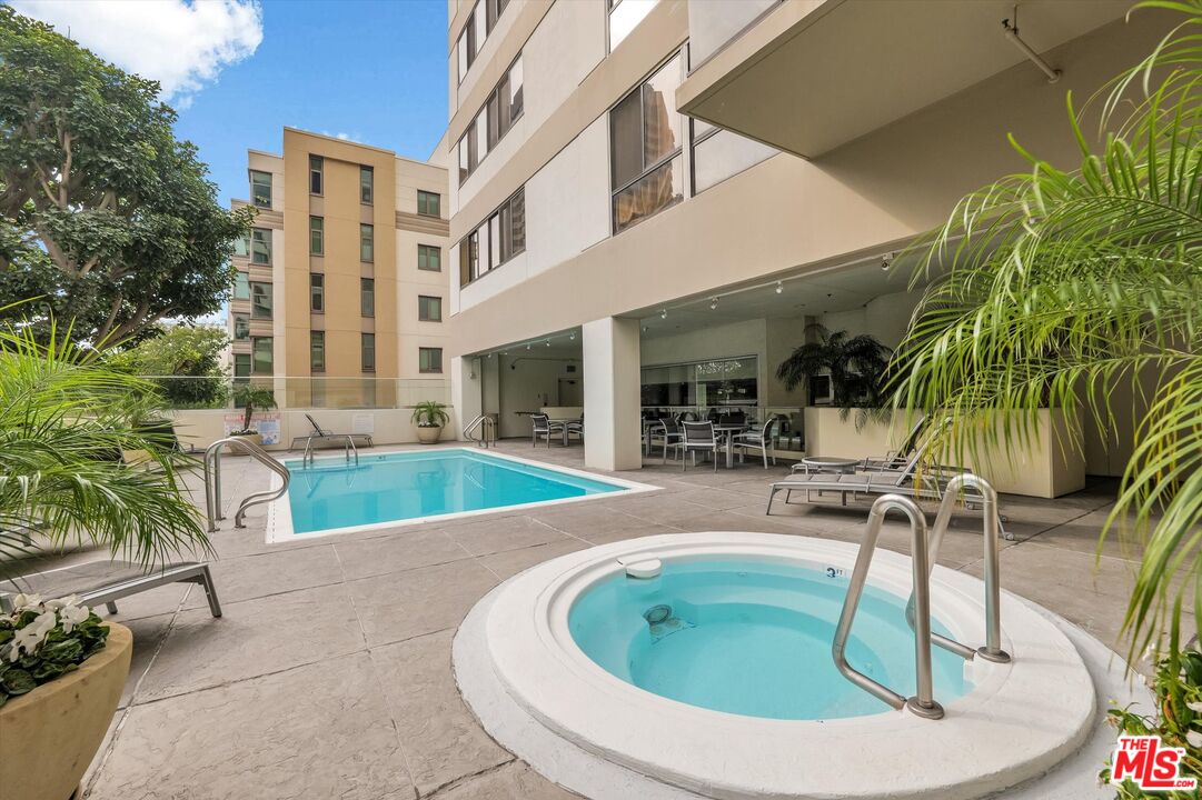 10445 Wilshire Boulevard, Unit 904 Los Angeles, CA 90024 - Photo 33 of 40 a view of a house with swimming pool
