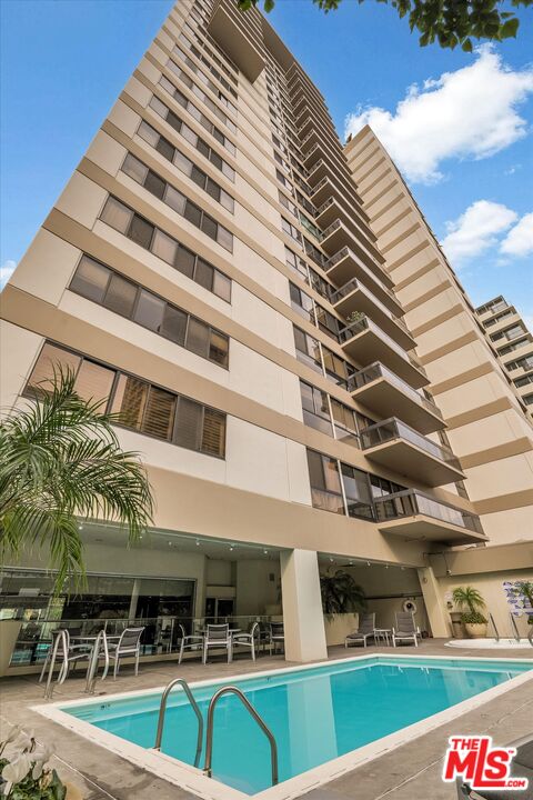 10445 Wilshire Boulevard, Unit 904 Los Angeles, CA 90024 - Photo 34 of 40 a view of a building with a swimming pool