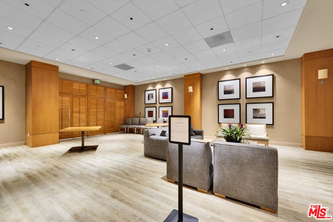 10445 Wilshire Boulevard, Unit 904 Los Angeles, CA 90024 - Photo 36 of 40 a living room with furniture and large windows