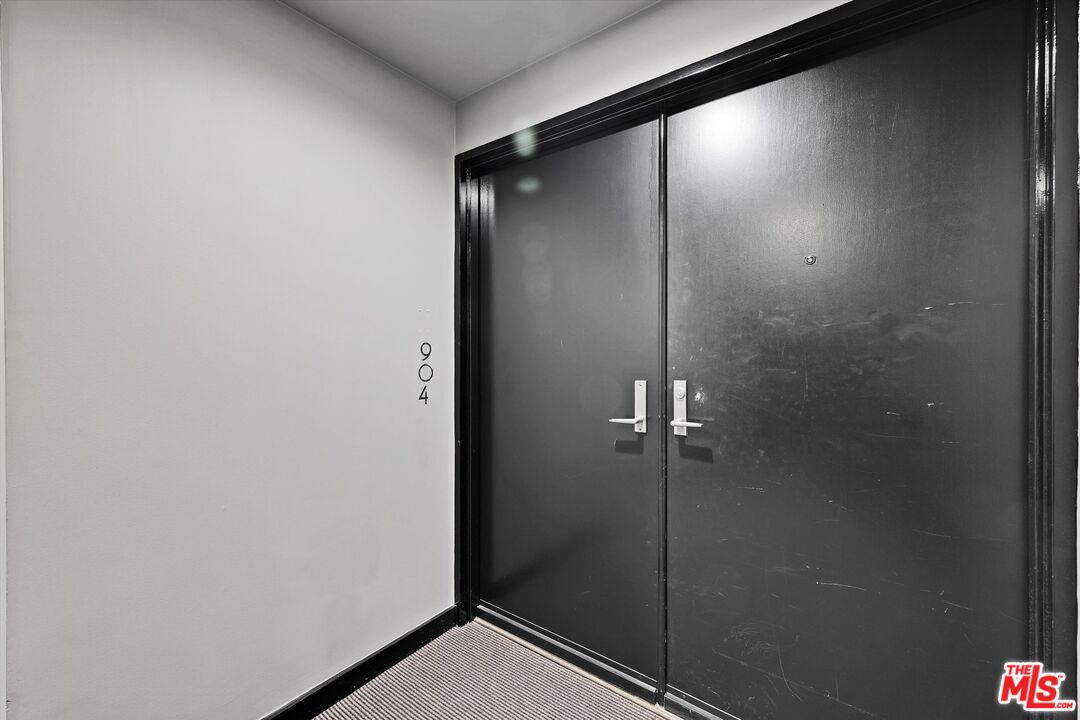 10445 Wilshire Boulevard, Unit 904 Los Angeles, CA 90024 - Photo 5 of 40 a bathroom with a shower and a glass door