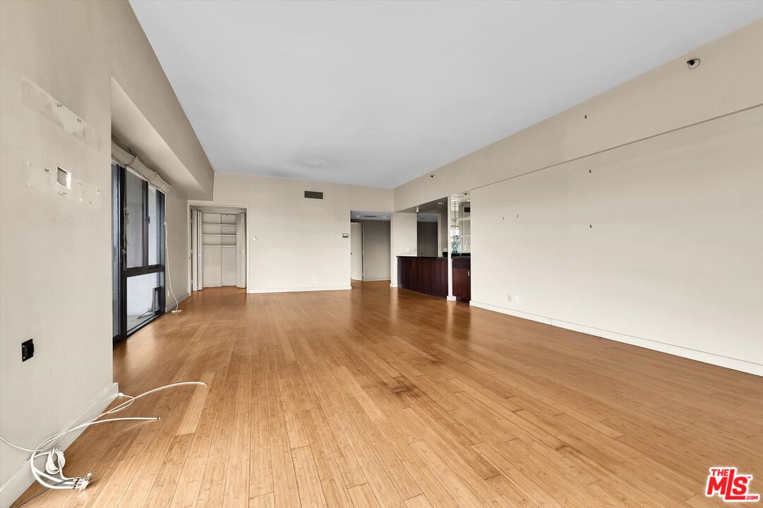 10445 Wilshire Boulevard, Unit 904 Los Angeles, CA 90024 - Photo 8 of 40 a view of empty room with wooden floor