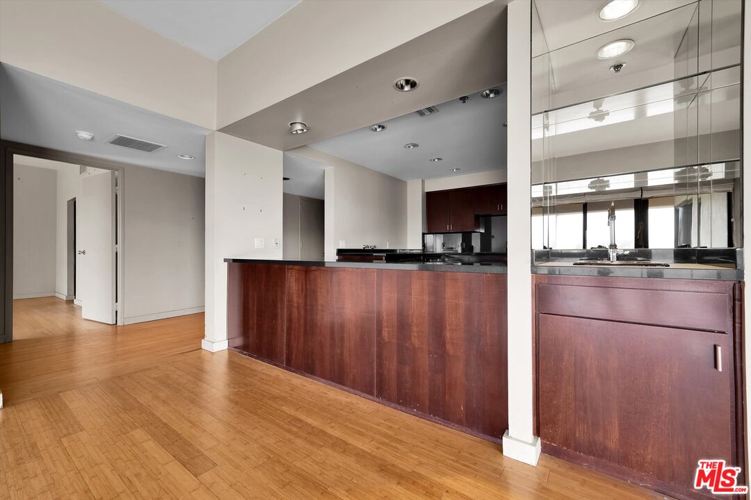 10445 Wilshire Boulevard, Unit 904 Los Angeles, CA 90024 - Photo 9 of 40 a kitchen with stainless steel appliances granite countertop a refrigerator and a sink