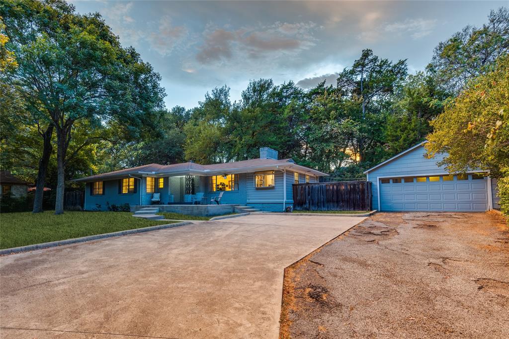 737 North Hampton Road Dallas, TX 75208 - Photo 2 of 30 Low-slung architecture settles naturally beneath a canopy of mature trees.