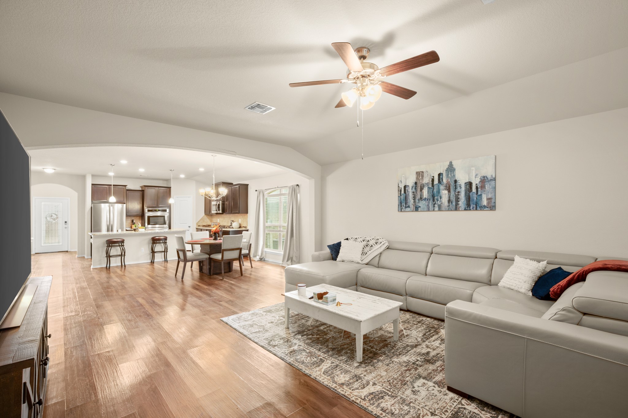 5526 Perdita Drive Belton, TX 76513 - Photo 7 of 26 Living area with light wood finished floors, a ceiling fan, arched walkways, recessed lighting, and lofted ceiling