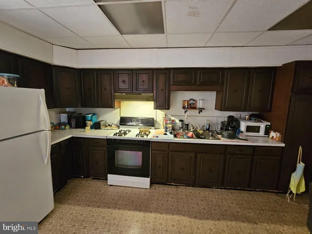 a kitchen with sink cabinets and window