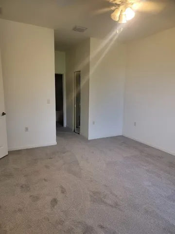 wooden floor in a room next to a window