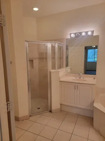 a bathroom with a bathtub and shower