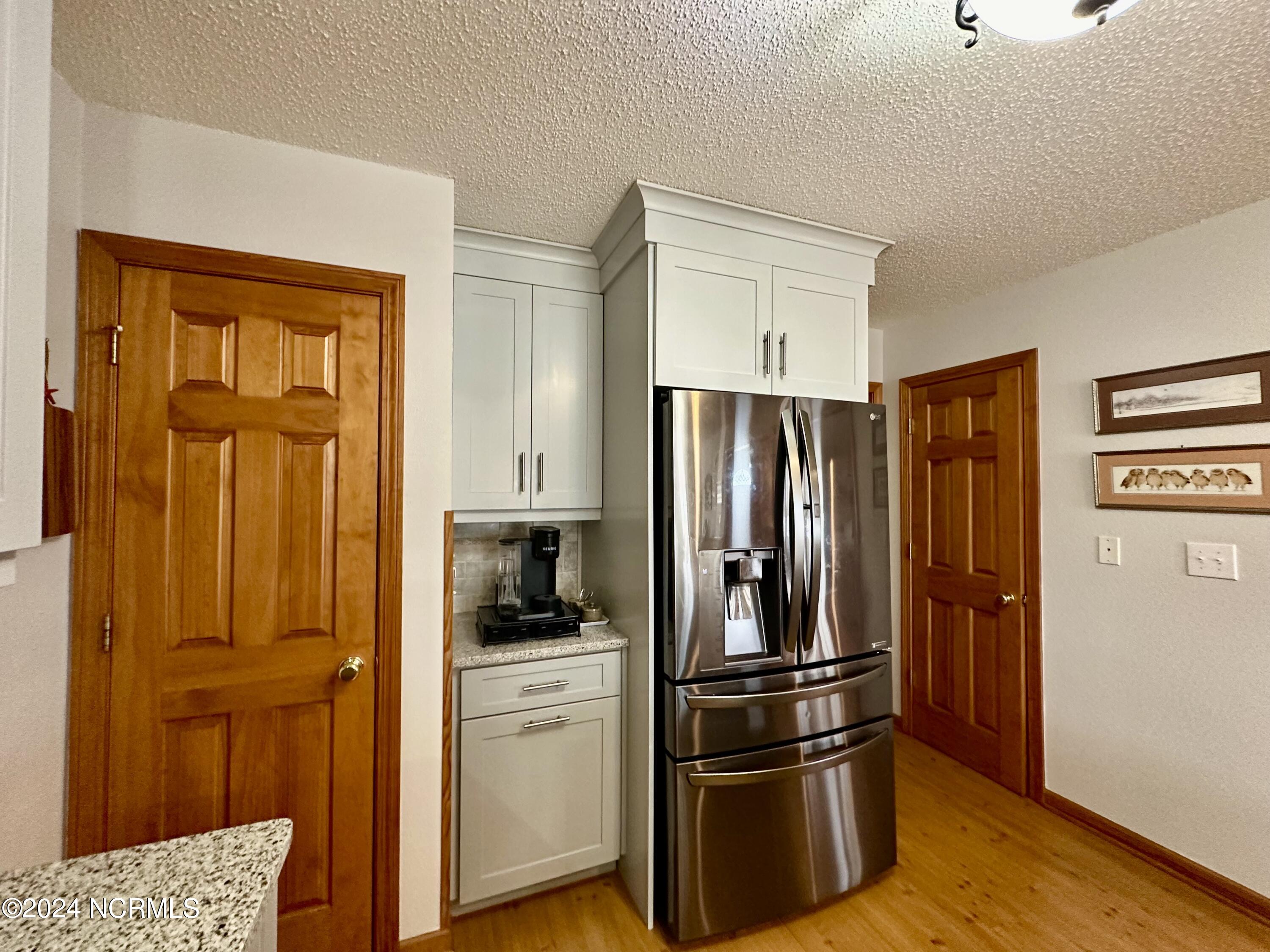 1231 Macedonia Road Edenton, NC 27932 - Photo 12 of 55 Pantry door on the left. Half bath door on the right. Laundry just beyond the kitchen.