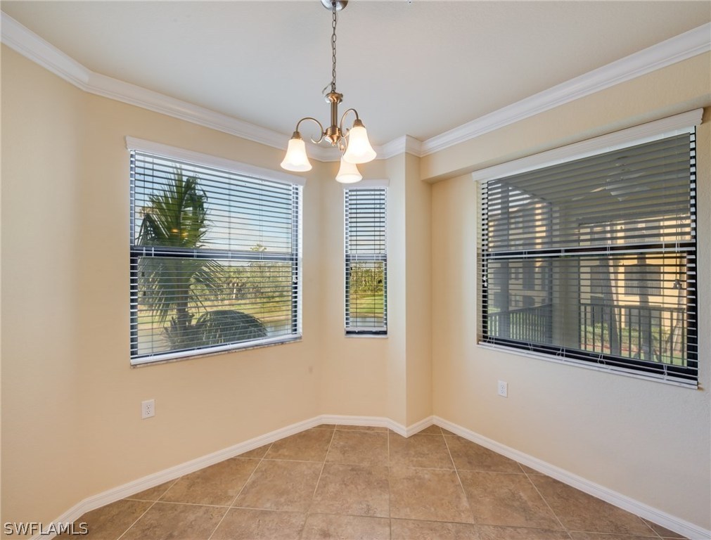 9727 Acqua Court, Unit 413 Naples, FL 34113 - Photo 11 of 35 a view of an empty room with a window